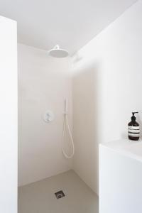 a bathroom with white walls and a white ceiling at PYLA: Nice creative studio 200 m from the beach in La Teste-de-Buch