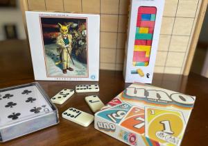 a table with a game and dice on a table at BLUE HOUSE - Traditional Home - 5min, Beach, Bus, Train in Beppu