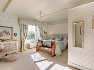 a bedroom with a bed and a large window at 3 Bed in Leyburn G0185 in Carlton