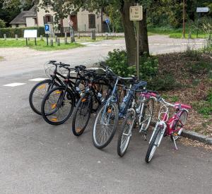 a group of bikes parked next to a street at CYGNE-CYCLES chambre d'hotes 