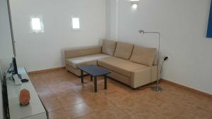 a living room with a couch and a table at Apartment Océano in Puerto de Tazacorte
