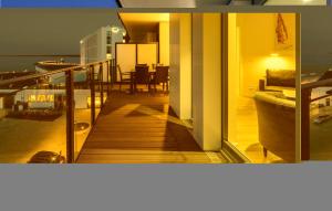 a view of a living room and a balcony of a house at Highend Travemünde - Whg 307 in Travemünde +26 photos