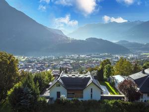 a view of a town with mountains in the background at Apartment Tschirgant Deluxe in Imst