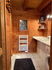 a small kitchen with a sink and a window at Chalet 3 étoiles à Gérardmer. in Gérardmer +65 photos