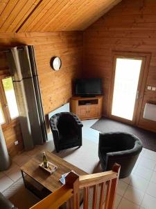Μια τηλεόραση ή/και κέντρο ψυχαγωγίας στο Chalet 3 étoiles à Gérardmer.