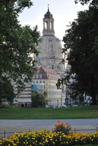 a large building with a tower on top of it at City Apart Dresden Apartment 4 in Dresden