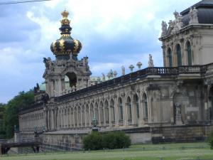 an ornate building with a gold top on top of it at City Apart Dresden Apartment 4 in Dresden
