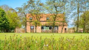 Κήπος έξω από το Hello Zeeland - Vakantiewoning Hoeve De Lente +7 φωτογραφίες