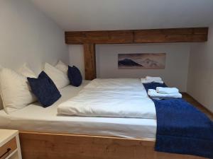 Postel nebo postele na pokoji v ubytování MountApart Ski in - Ski out - Sommercard zum halben Preis - Gültig von Juli bis September 2025
