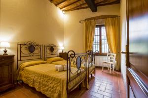 Postel nebo postele na pokoji v ubytování Casale Fontocchio