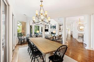 a dining room and living room with a table and chairs at 296 Marsh Cove in Kiawah Island