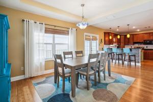 a dining room and kitchen with a table and chairs at Gulfport Getaway in St. Petersburg
