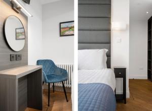 鄧弗姆林的住宿－312 Reids Corner - by StayDunfermline，一间卧室配有一张床、一张书桌和一面镜子