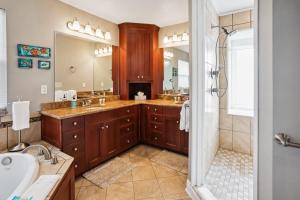 a bathroom with two sinks and a shower at Gulfport Getaway in St. Petersburg +50 photos