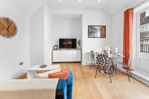 a living room with a couch and a table at Modern Apartment in city Centre of Canterbury in Kent