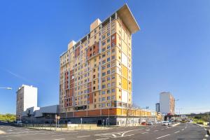 a tall building on the corner of a street at Spacious 2BR apartment with free parking in Lisbon by Soulplaces in Lisbon