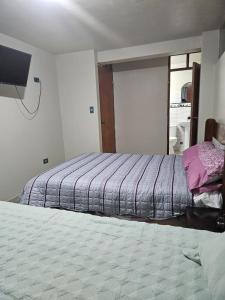 Een bed of bedden in een kamer bij PEPE´S HOUSE