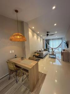 a living room with a table and a couch at Hotel Buena Vista in Bucaramanga