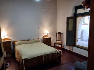 Ένα ή περισσότερα κρεβάτια σε δωμάτιο στο Hospedaje FliaMaria