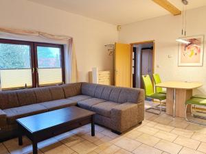 a living room with a couch and a table at Ferienwohnungen Stadtmitte in Sassnitz