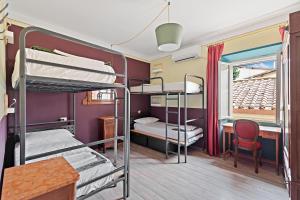 Posteľ alebo postele v izbe v ubytovaní Ostello Bello Firenze