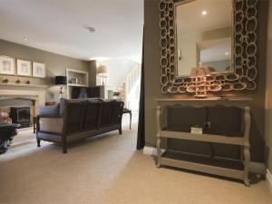 a living room with a mirror on the wall at 1 Bed in Pateley Bridge G0026 in Pateley Bridge