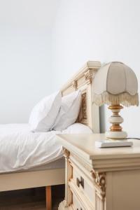 Postel nebo postele na pokoji v ubytování Sonorus Apartment