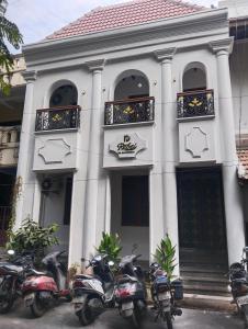 a group of motorcycles parked in front of a building at Rebel de Pondiche'ry in Pondicherry