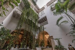 a building with ivy growing up the side of it at Hotel Noi 1860 Cartagena in Cartagena de Indias