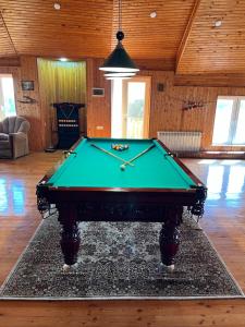 a pool table in the middle of a room at Luxury Villa with pool and waterfall in Bina