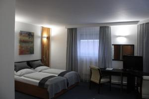 Posteľ alebo postele v izbe v ubytovaní Hotel P7