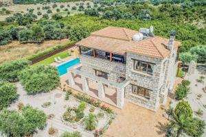 an aerial view of a house with a swimming pool at Villa Aphrodite Argaka in Argaka