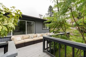 a patio with a couch on a deck at Solana Beach Home 4 blocks from the Ocean in Solana Beach