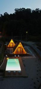 a house with a swimming pool in front of it at Casas da Madrinha in Arcos de Valdevez