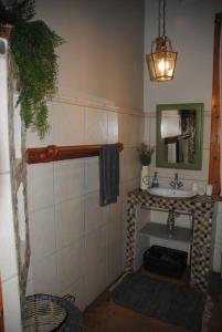 a bathroom with a sink and a mirror at Charming 3 bedroom house -No Loadshedding in Pretoria