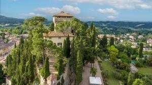 un edificio en la cima de una colina con árboles en Rocca di Cetona - a Medieval Castle, en Cetona