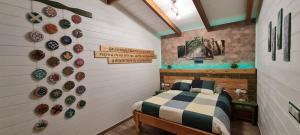 a bedroom with a bed with plates on the wall at Villa Maribel in Busot +107 photos