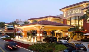 a large building with a fountain in front of it at 4-PLEX in Fort Lauderdale