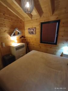 Ένα ή περισσότερα κρεβάτια σε δωμάτιο στο Ferienhaus Merlin