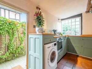 a laundry room with a washer and dryer at Dukes Lodge in Kersey