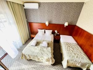 Postel nebo postele na pokoji v ubytování Hotel&Spa Stary Dziwnów basen swimming pool
