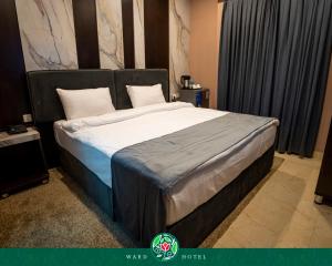 เตียงในห้องที่ Ward Hotel Basra