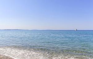 a large body of water with a boat in the distance at Lovely Home In Melito Di Porto Salvo in Melito di Porto Salvo