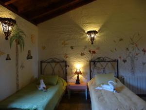 Tempat tidur dalam kamar di Casa Rural La Gustoza