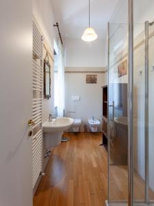 a bathroom with two sinks and a shower at Casa Daniela in Trento