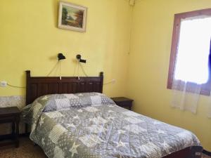 Ένα ή περισσότερα κρεβάτια σε δωμάτιο στο Andora Casa