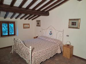 Posteľ alebo postele v izbe v ubytovaní Podere Il Caggio Rooms