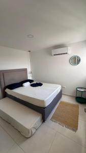Giường trong phòng chung tại Mirador del Lago by Olamar Living