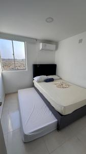 Giường trong phòng chung tại Mirador del Lago by Olamar Living