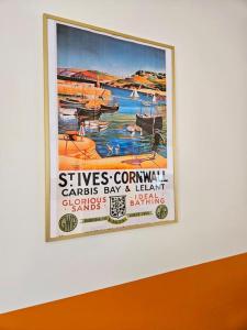 een poster aan een muur bij "Beachcomber" Cosy Town Centre & Beach Apartment! in St Ives